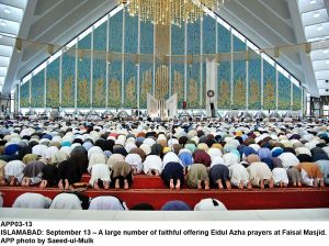 APP03-13 ISLAMABAD: September 13 A large number of faithful offering Eidul Azha prayers at Faisal Masjid. APP photo by Saeed-ul-Mulk
