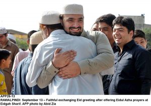 APP26-13 RAWALPINDI: September 13 Faithful exchanging Eid greeting after offering Eidul Azha prayers at Eidgah Sharif. APP photo by Abid Zia