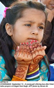 APP50-13 HYDERABAD: September 13 A young girl offering dua after Eidul Azha prayers at Eidgah Rani Bagh. APP photo by Akram Ali