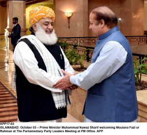 APP17-03 ISLAMABAD: October 03 Prime Minister Muhammad Nawaz Sharif welcoming Moulana Fazl ur Rahman at The Parliamentary Party Leaders Meeting at PM Office. APP